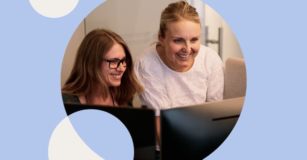 Photo of two women working in office